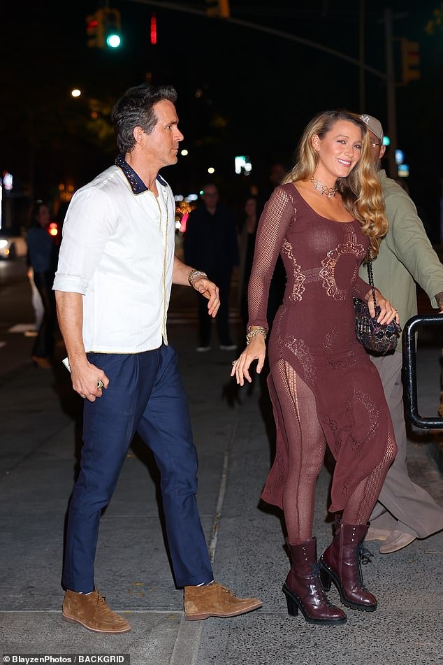 Blake, 37, looked absolutely stunning in a completely sheer burgundy number consisting of a clinging dress over matching stockings and leather booties