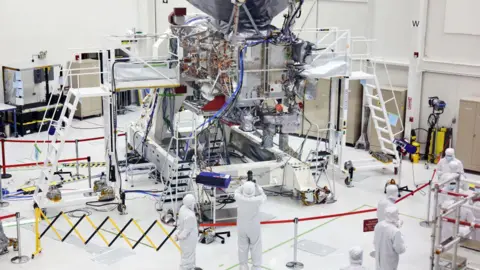 Getty Images The NASA Europa Clipper spacecraft is viewed during a media tour inside a Spacecraft Assembly Facility clean room at NASA's Jet Propulsion Laboratory (JPL) on April 11, 2024 in Pasadena, California.